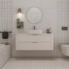 A modern bathroom vanity with a sink, mirror, and toilet. Anteprima dell’immagine prodotto
