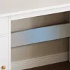 A close-up view of a white desk with a blue shelf. Náhled obrázku produktu