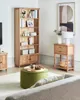 A living room scene with a bookshelf, ottoman, and side table. Náhľad obrázku produktu