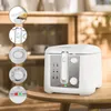 A white deep fryer is placed on a wooden table in front of a wooden cabinet. There are inset circular images showing details of the fryer. Produktbild-Vorschau