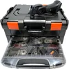 A black tool case with orange accents, containing various cutting blades and an oscillating multi-tool on top. Produktbild-Vorschau