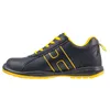A side view of a black and yellow work shoe. Produktbild-Vorschau