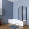 A modern bathroom with a white bathtub and a black framed glass shower screen. Produktbild-Vorschau