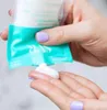 A person's hands are squeezing a tube of cream onto their palm. Produktbild-Vorschau