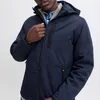 A man wearing a blue jacket and a blue shirt. Produktbild-Vorschau