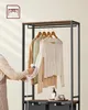 A person is steaming clothes on a garment rack. Produktbild-Vorschau