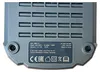 The underside of a battery charger with a label showing product information and certifications. Podgląd zdjęcia produktu