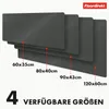 A stack of dark gray desk mats of varying sizes, with dimensions labeled. Anteprima dell’immagine prodotto
