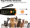 A dog training device with a group of dogs below it. Produktbild-Vorschau
