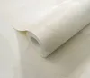 A roll of wallpaper with a floral pattern. Podgląd zdjęcia produktu