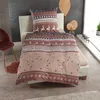 A bed with winter-themed bedding is set up in a room with decorative elements. Produktbild-Vorschau