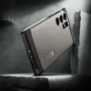 A phone case is shown in a dramatic, studio-like setting with dramatic lighting and rough, textured surfaces. Náhled obrázku produktu