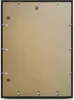 The back of a black picture frame with a brown backing board and metal clips. Produktbild-Vorschau