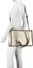 A mannequin wearing a white outfit and a Valentino Bags Shopper Candle Beige 26 bag. Anteprima dell’immagine prodotto