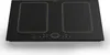 A top-down view of a black induction cooktop with gold trim, set against a white background. Produktbild-Vorschau