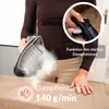 A person is using a steam iron on a piece of fabric, with text overlays highlighting product features. Produktbild-Vorschau