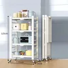 A white four-tier kitchen cart with various kitchen appliances and containers on it, shown next to a folded version of the same cart. Produktbild-Vorschau
