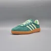 A single Adidas Handball Spezial shoe is shown against a plain gray background. Produktbild-Vorschau