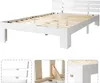 A white wooden bed frame with a slatted base, shown from a slightly elevated side angle against a white background. Below the main image are three smaller inset images showing details of the bed frame construction. Náhled obrázku produktu