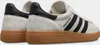 A pair of Adidas Handball Spezial shoes in Aluminium Grey with a Gum sole, shown from the back and side. Voir les images du produit