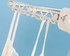 A close-up shot of a gray drying rack with white bra straps hanging from it. Náhled obrázku produktu