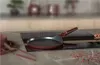 A kitchen counter with a stovetop, a frying pan, and cutlery. Náhľad obrázku produktu
