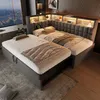 A modern bedroom with a modular bed setup, featuring built-in lighting and storage, overlooking a city skyline at night. Náhled obrázku produktu