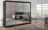 A modern bedroom with a large mirrored wardrobe reflecting a living room scene with a sofa and a window. Náhľad obrázku produktu