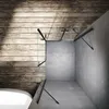 A modern bathroom with a glass shower enclosure, concrete walls, and wooden accents. Anteprima dell’immagine prodotto