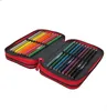 A red pencil case is open, displaying rows of colored pencils. Náhled obrázku produktu