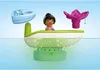 A toy boat with a figure and accessories floating on water. Náhľad obrázku produktu