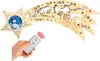 A wooden shooting star decoration with a snowman image on one of its points, being held by a hand holding a remote control. Produktbild-Vorschau