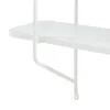 A close-up view of a white shelf bracket and part of a shelf. Podgląd zdjęcia produktu