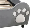 A close-up of a grey upholstered bed frame with a paw print design. Náhľad obrázku produktu