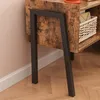 Close-up of a rustic nightstand leg and shelf with a basket. Podgląd zdjęcia produktu