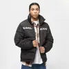 A man wearing a black puffer jacket with white lettering and a plaid shirt underneath, posing against a white background. Voir les images du produit