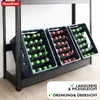 A metal shelving unit holding three crates of bottled drinks. Produktbild-Vorschau
