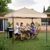 A family enjoys a meal under a canopy in a backyard setting. Produktbild-Vorschau