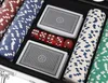 A close-up view of a poker set inside a case, showing poker chips, playing cards, and dice. Náhľad obrázku produktu