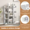 A white tree-shaped bookshelf is shown with decorative items on its shelves. The image also includes marketing text and diagrams highlighting safety features. Podgląd zdjęcia produktu