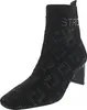 A black knitted boot with a patterned design and a block heel, presented against a white background. Produktbild-Vorschau