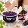 Loeffel hebt Popping Boba Traube Perlen aus der Schale fuer ein Dessert Podgląd zdjęcia produktu