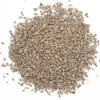 A pile of small, irregular, brown and gray granules on a white background. Produktbild-Vorschau