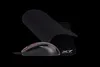A black gaming mouse and a black mousepad are displayed against a black background. Anteprima dell’immagine prodotto