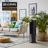 A modern living room scene featuring a sofa, a tower fan, and decorative items. Produktbild-Vorschau