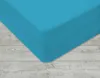 A close-up view of a turquoise fitted sheet on a wooden floor. Náhled obrázku produktu