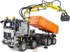 A Lego Technic model of a remote-controlled truck with a crane and dump bed. Voir les images du produit
