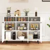A white sideboard cabinet filled with various kitchen items and food products, set against a white wall. Produktbild-Vorschau