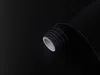 A roll of black adhesive film is shown against a black background. Produktbild-Vorschau