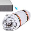 A mattress is shown partially rolled up and vacuum-sealed in plastic, with rainbow-colored straps holding it together. An arrow indicates the process of rolling up the mattress. Produktbild-Vorschau